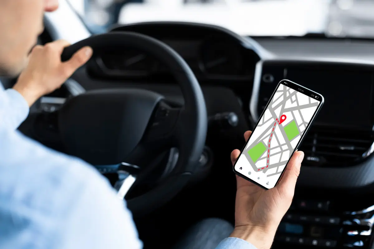 Hands holding a smartphone with Google Maps open