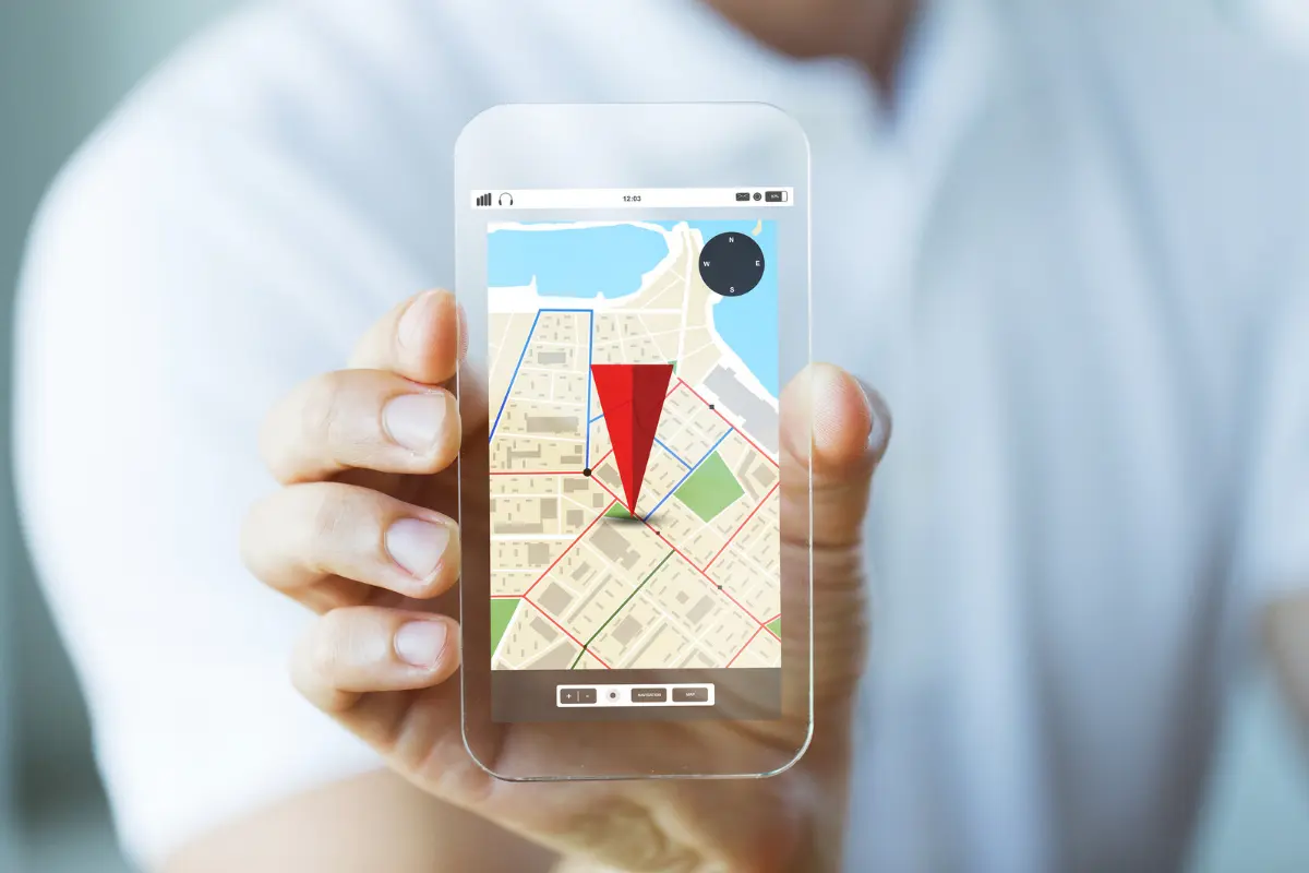 Hands holding a smartphone with Google Maps open