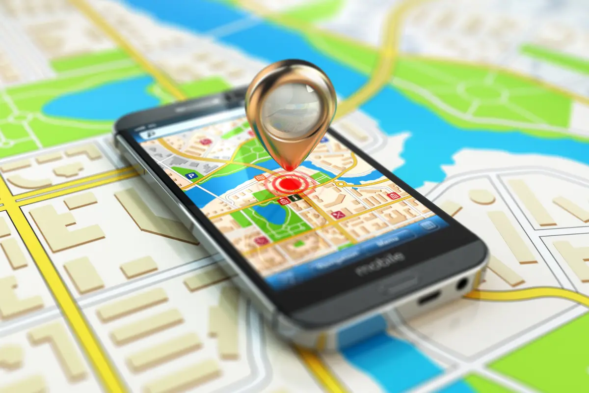 Hands holding a smartphone with Google Maps open