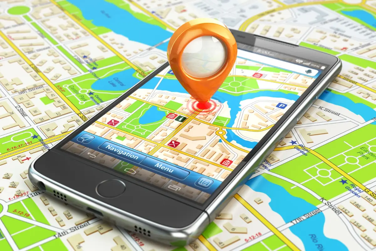 Hands holding a smartphone with Google Maps open