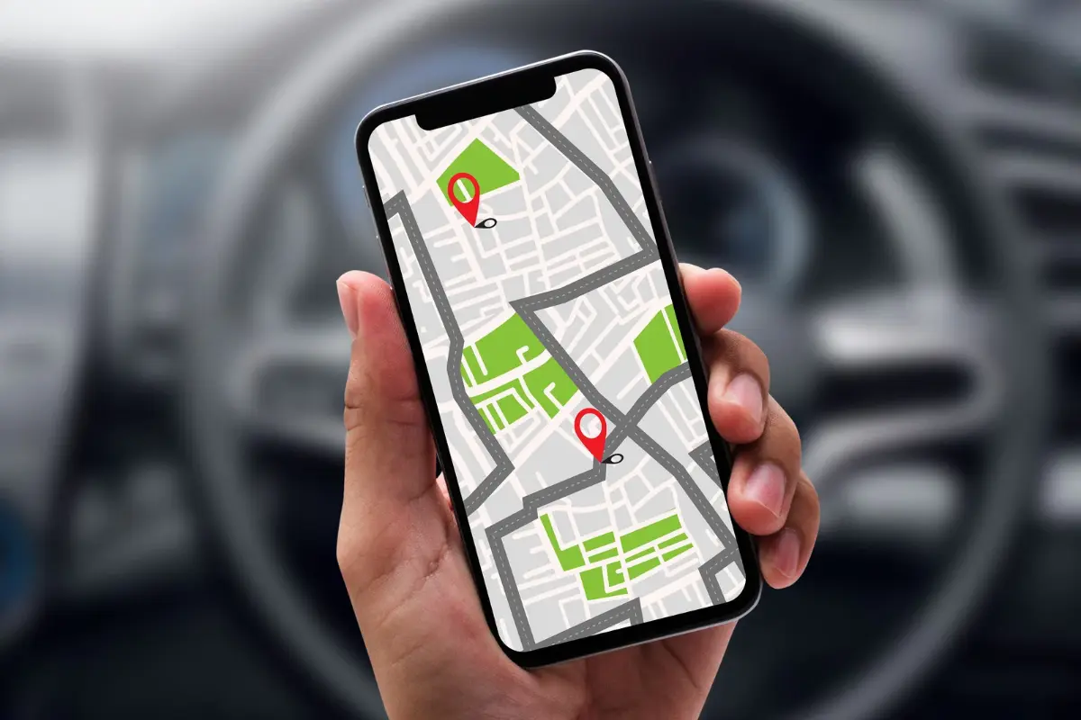 Hands holding a smartphone with Google Maps open